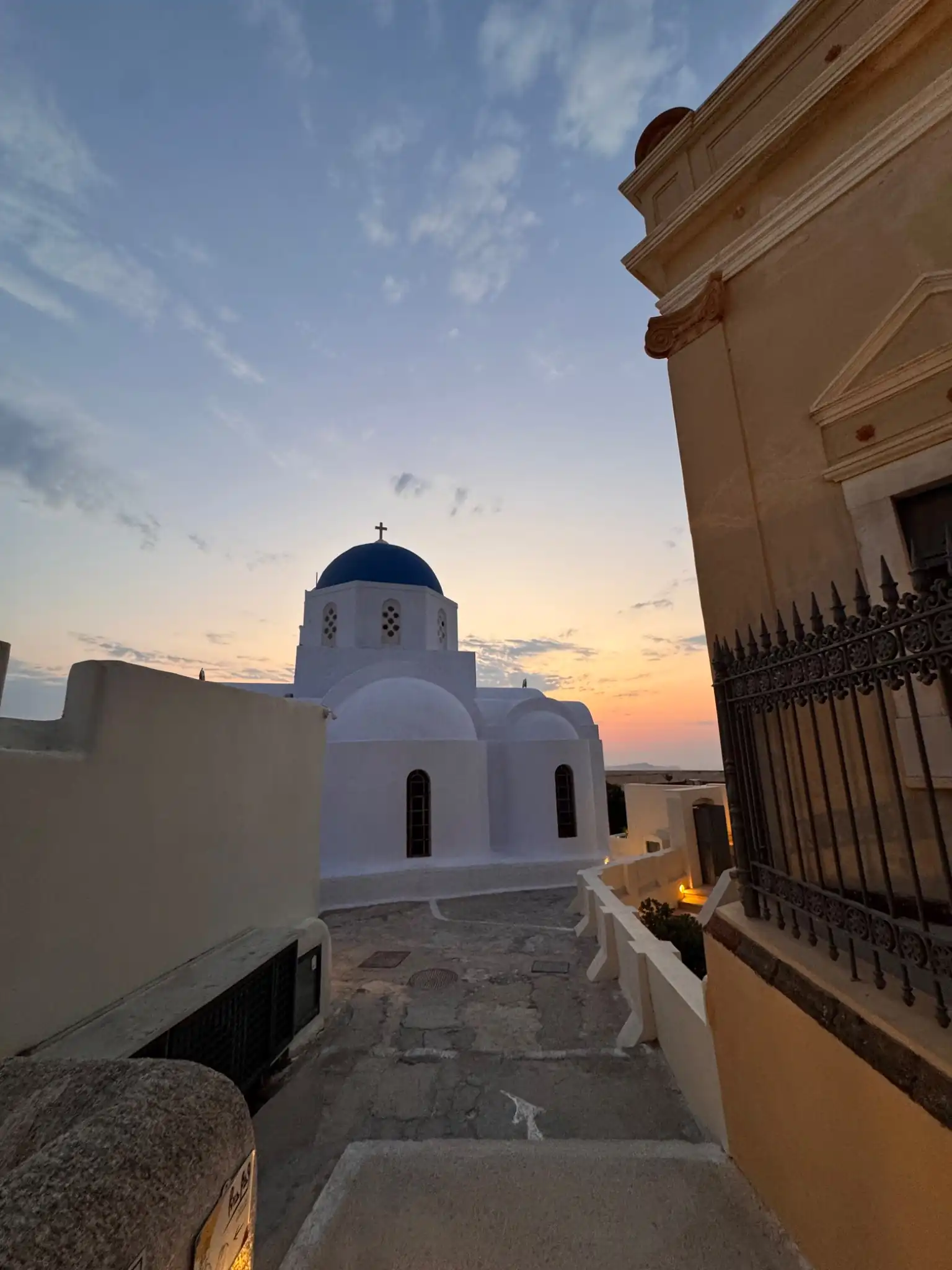Pyrgos Santorini blue dome and sunset